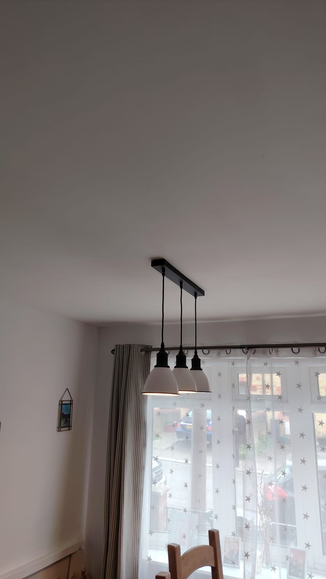 Pendant light installation in a residential dining room